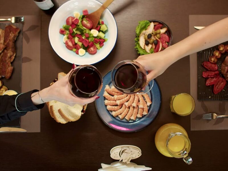 A dinner table with drinks, seen from above